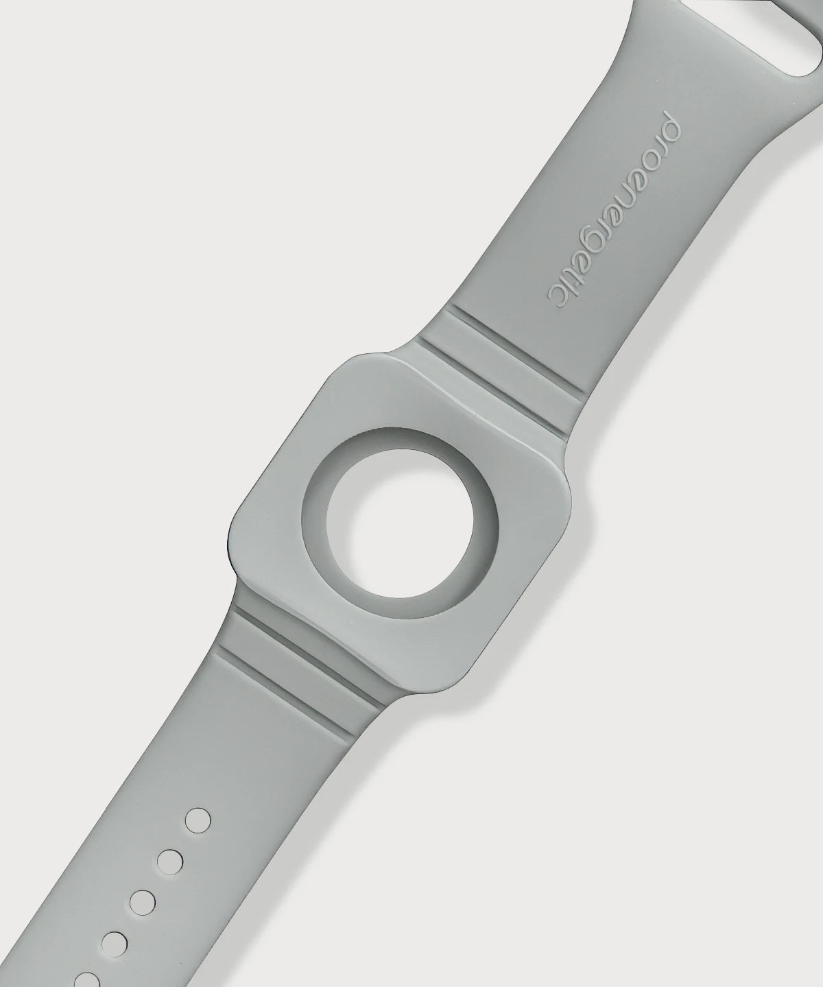 Detailansicht des Eloop Bands als graues Silikonarmband mit rundem Einsatz und eingeprägtem Markenschriftzug auf hellem Hintergrund