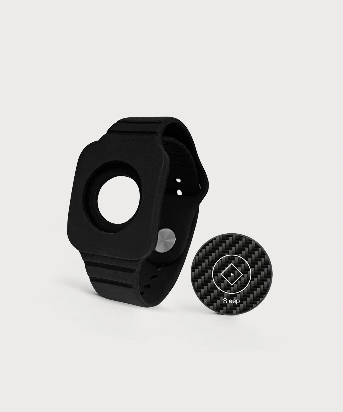 Modulares schwarzes Eloop Band mit einem austauschbaren Carbon-Chip mit der Variante "Sleep" auf hellem Hintergrund.