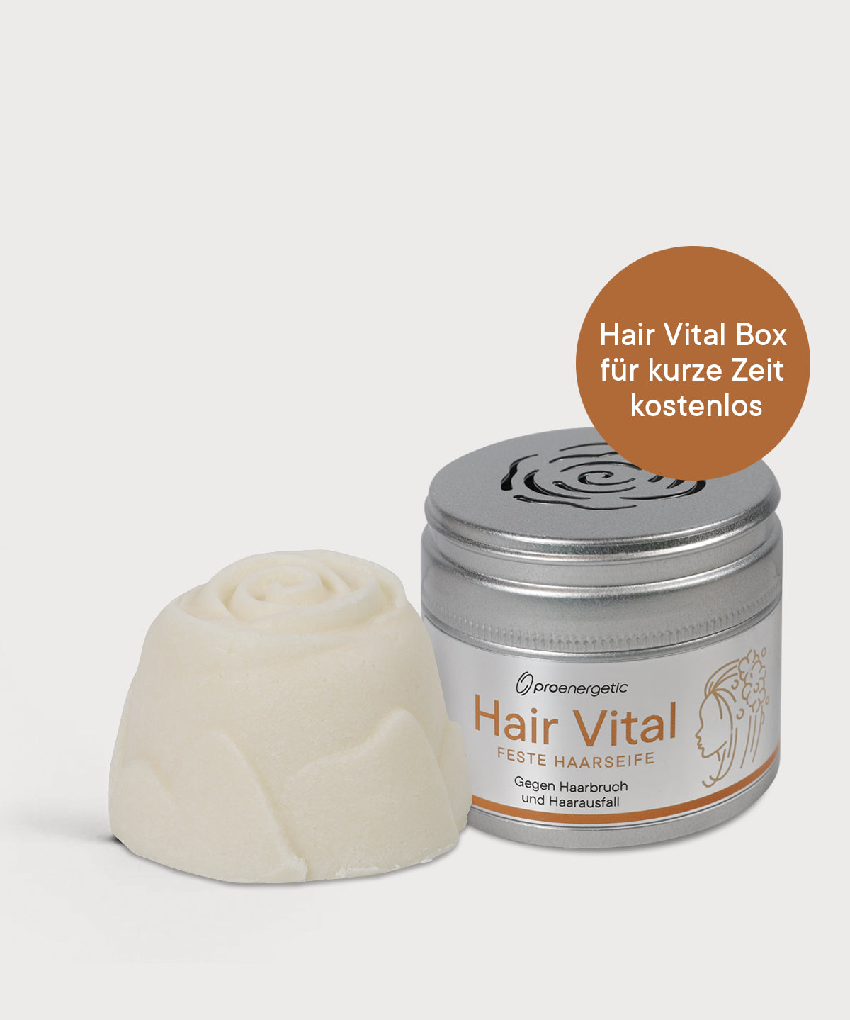 Hair Vital Haarseife neben Hair Vital Box mit Schraubdeckel auf hellem Hintergrund.