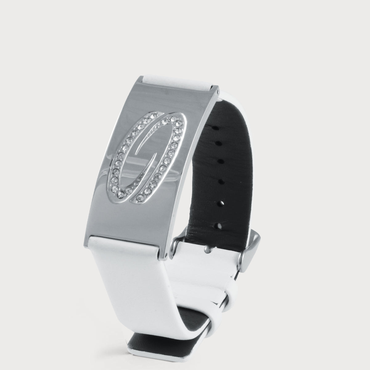 White “I AM Love” bracelet with a leather strap and a silver-colored metal element featuring crystals on a light-colored background