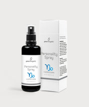 Schwarze Glasflasche Personality Spray Steinbock von ProEnergetic neben weißer Produktverpackung mit Sternzeichen Symbol.