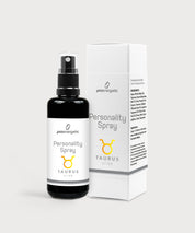 Schwarze Glasflasche Personality Spray Stier von ProEnergetic neben weißer Produktverpackung mit Sternzeichen Symbol.