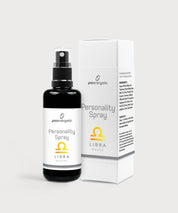 Schwarze Glasflasche Personality Spray Waage von ProEnergetic neben weißer Produktverpackung mit Sternzeichen Symbol.