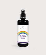 Rainbow Spray in schwarzer Sprühflasche mit weißem Etikett, Regenbogenmotiv und violettem Schriftzug auf hellem Hintergrund
