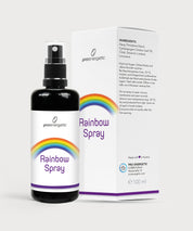 Rainbow Spray in schwarzer Sprühflasche mit Regenbogenetikett, daneben weiße Produktverpackung mit Inhaltsangaben auf hellem Hintergrund